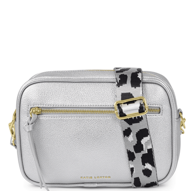Silver crossbody bag with a patterned strap on a white background