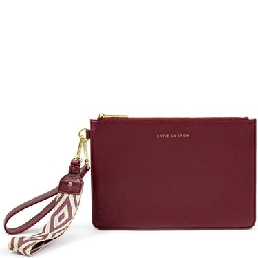 Maroon clutch bag with a strap on a white background