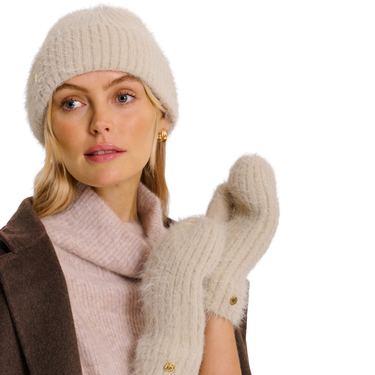 Woman wearing a beige knit hat, scarf, and mittens on a white background