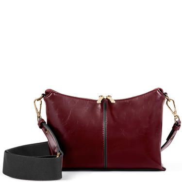 Maroon leather handbag with gold zipper and black strap on a white background