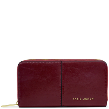 Red leather wallet with gold zipper and 'Katie Loxton' branding on a white background