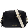A black pebbled leather crossbody bag by Katie Loxton with a wide cream-colored shoulder strap featuring black trim and a gold buckle, shown on a plain white background.