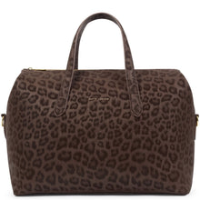 A dark brown leopard-print duffle bag with two top handles, gold-tone hardware, and a small gold  logo plaque on the front, shown against a plain white background.