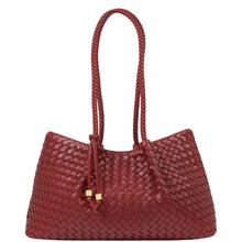 A woven leather tote bag in a deep burgundy red, featuring two braided shoulder straps and small gold-tone hardware accents, set against a plain white background.