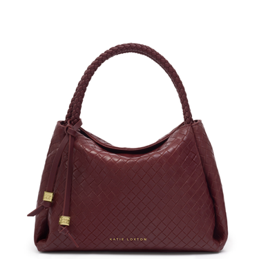 Maroon handbag with braided handle on a white background