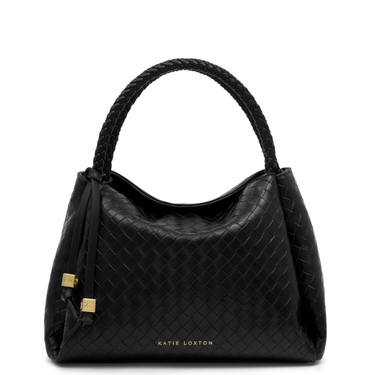Black quilted handbag with braided handle on a white background