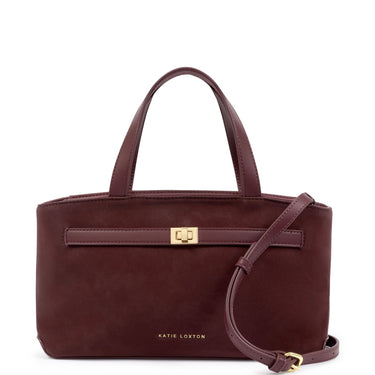 A dark burgundy leather handbag by Katie Loxton with a gold clasp and a matching shoulder strap, shown on a plain white background.