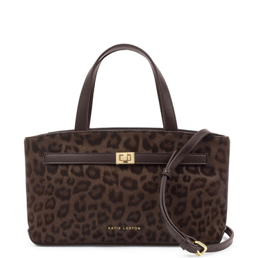 A brown leopard print handbag by Katie Loxton, featuring dark brown leather handles, a matching front strap with a gold-tone clasp, and a detachable shoulder strap, set against a plain white background.