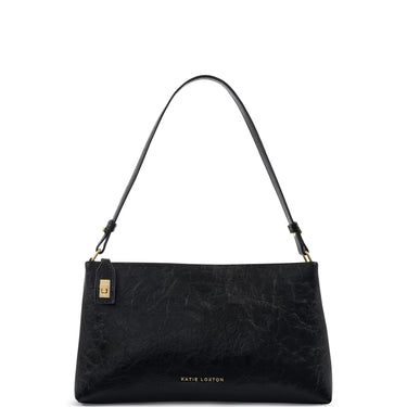 A black textured leather shoulder bag by Katie Loxton with a gold-tone logo plaque and 'KATIE LOXTON' branding on the front, set against a plain white background.