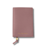 Pink leather wallet with 'Stay for Vacay' text on passport cover
