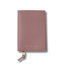 Pink leather wallet with 'Stay for Vacay' text on passport cover