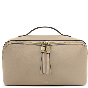 Beige toiletry bag with gold zipper and black handle on a white background