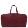Maroon leather bag with gold accents on a white background
