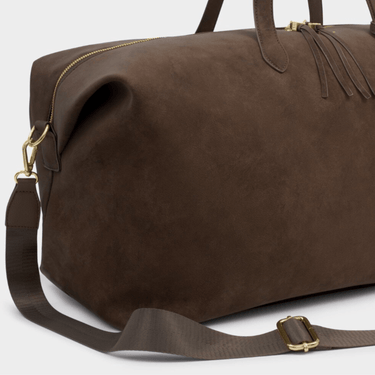 brown suede travel bag with shoulder strap