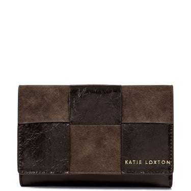 A Katie Loxton patchwork wallet in dark brown and medium brown textured leather, featuring gold lettering on the bottom right, set against a plain white background.