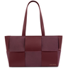Maroon woven handbag on a white background