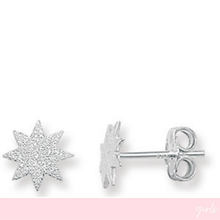 Silver star-shaped earrings on a white background