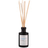 LA BOUGIE Honeysuckle & Sea Salt reed diffuser with a matte black bottle and natural light wood reeds, on a solid white background.