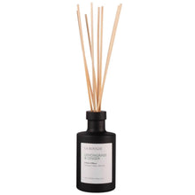A reed diffuser bottle by La Bougie in a matte black finish with a white label reading 'Lemongrass & Ginger'. Natural light wood reeds are inserted into the top, set against a plain white background.