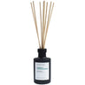 A reed diffuser bottle in matte black with natural wood reeds, featuring a white label with green and black text that reads 'LA BOUGIE LICHEN & WINTER JASMINE'.