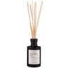 La Bougie Mission Fig reed diffuser with a matte black bottle and natural light wood reeds, shown on a solid white background.