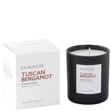 La Bougie Tuscan Bergamot scented candle in a matte black glass jar next to its white packaging box, on a clean white background.