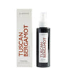 La Bougie Tuscan Bergamot A Linen Spray bottle next to its white packaging box, featuring red lettering and a white label.