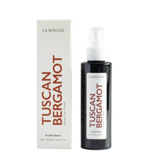 La Bougie Tuscan Bergamot A Linen Spray bottle next to its white packaging box, featuring red lettering and a white label.