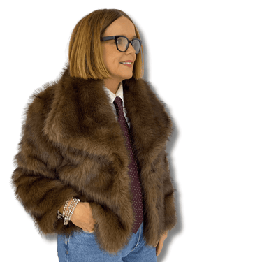 Person wearing a brown fur coat with a plain background