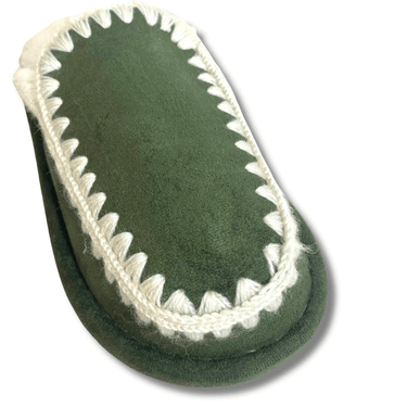 Green slipper with white trim on a white background