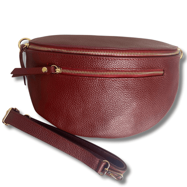 ladies leather dark red wine toned bag with two gold zips