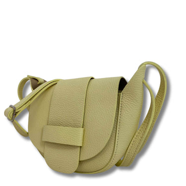 Green leather saddle bag on a white background