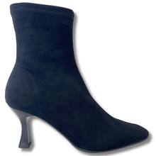 Navy blue sock boot with a thin heel on a white background