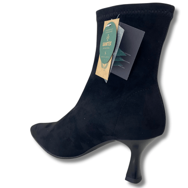 Black ankle boot with a brand tag on a white background