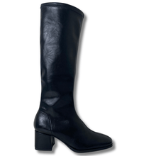 Black knee-high boot on a white background