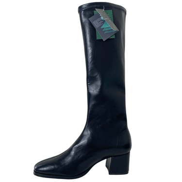 Black knee-high boot with a tag on a white background