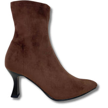 A brown suede ankle boot with a pointed toe and a black stiletto heel, shown from a side profile