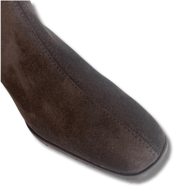 Brown suede shoe on a white background