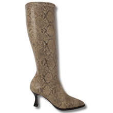 Tan knee-high boot with snake print on a white background