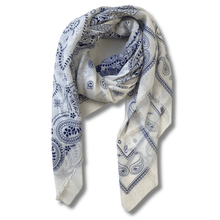 White scarf with blue paisley pattern on a white background