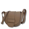 Brown leather saddle bag on a white background