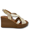 Gold wedge sandal with wooden sole on a white background