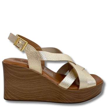 Gold wedge sandal with wooden sole on a white background