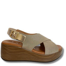 Beige sandal with wooden platform on a white background