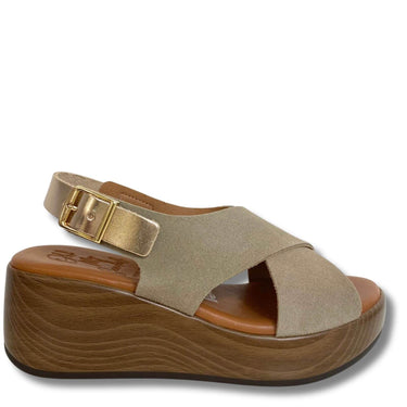 Beige sandal with wooden platform on a white background