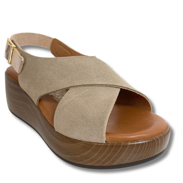 Beige sandal with wooden sole on a white background