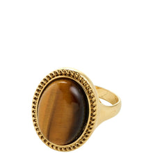 Gold ring with a brown gemstone on a white background