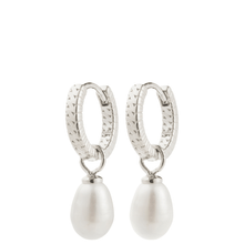 Silver hoop earrings with pearl drops on a white background