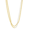Two layered Cuban link chains, one in yellow gold and one in silver, shown against a plain white background.