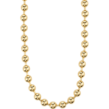 Gold beaded necklace on a white background